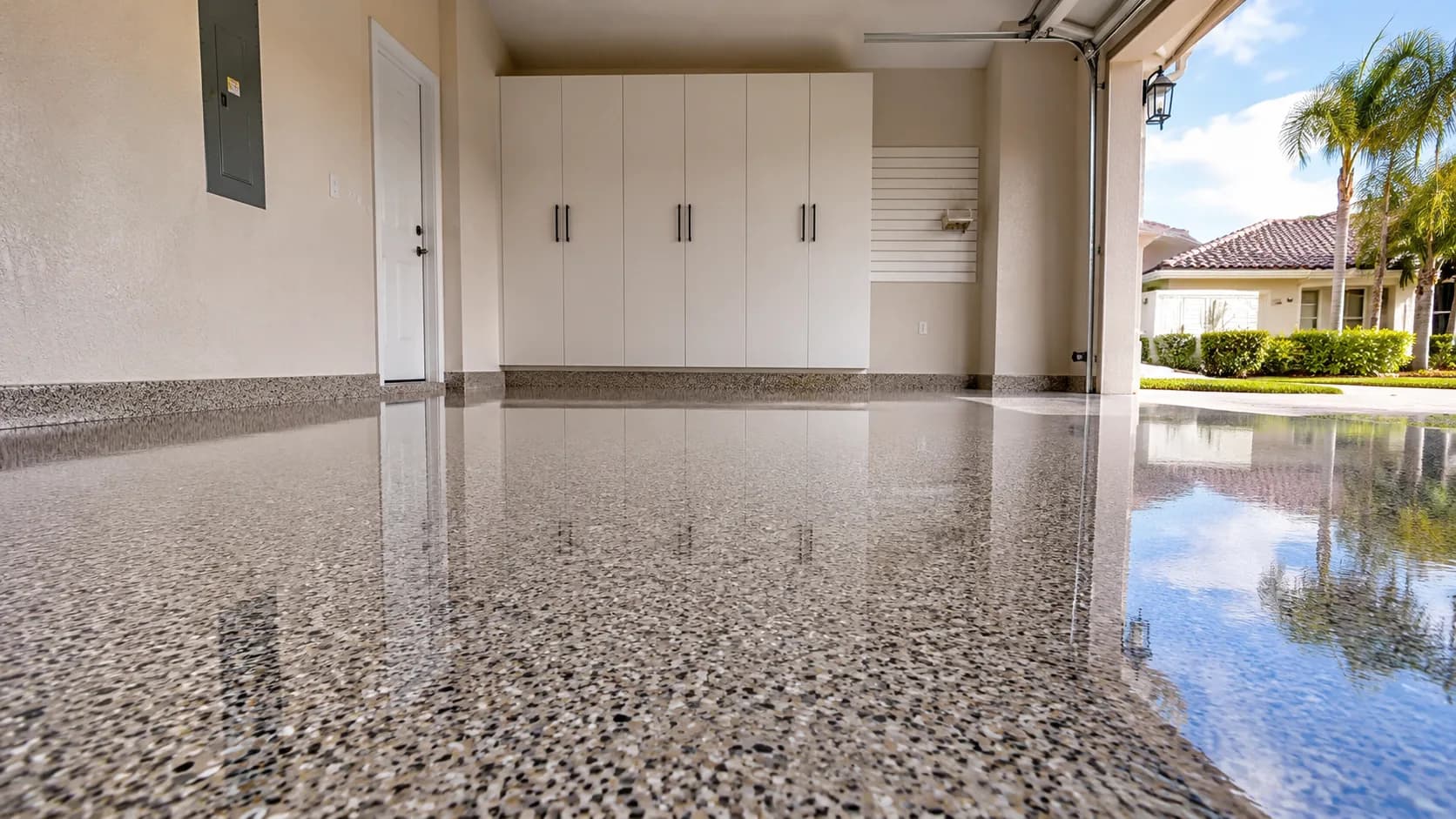 Finished high-gloss flake epoxy garage floor coating at a home in Cantonment, Florida
